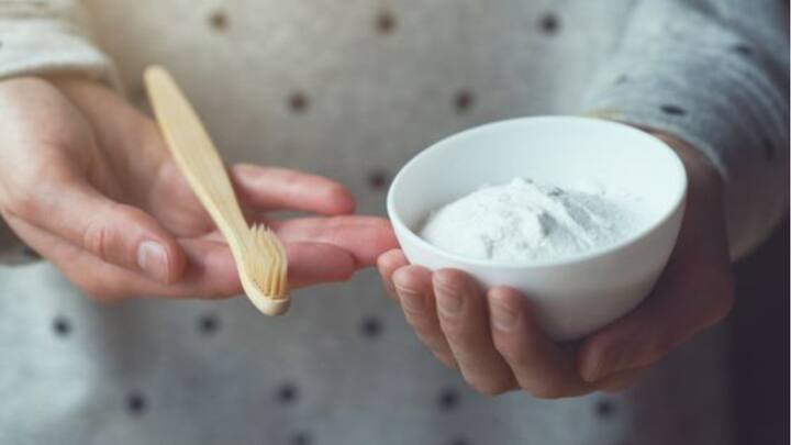 2. Baking Soda Paste: Mix baking soda with water to make a paste. Brush your teeth with it for natural whitening and acid neutralisation. (Image Source: Pinterest/officialwideopeneats)