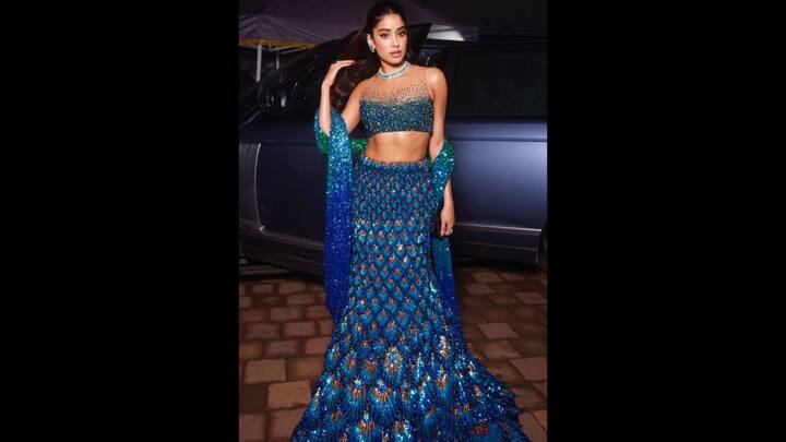 5. Jahanvi Kapoor: Jahanvi’s lehenga features a peacock inspired design with shimmering blue and green sequins, intricate embroidery and a mermaid inspired silhouette. It has been paired with a matching embellished dupatta, creating a vibrant and glamorous look. (Image Source: Twitter/@Celebs55Fashion)