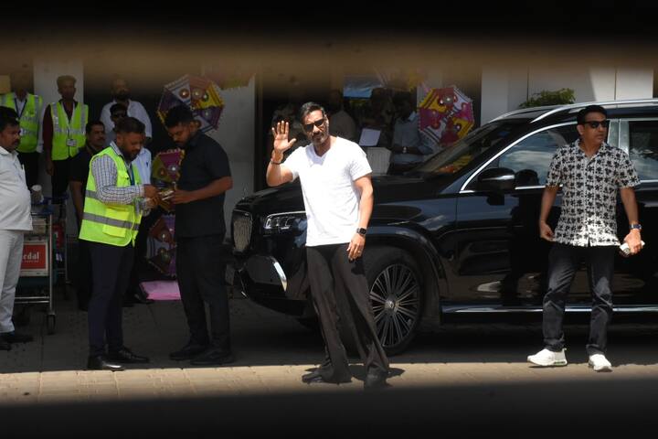 Ajay Devgn was spotted at the Kalina airport waving at the paparazzi stationed outside the airport.