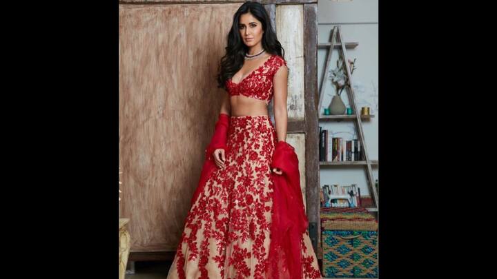 6. Katrina Kaif: The lehenga combines classic red and nude colours with floral embroidery. This bold and detailed look has been paired with a solid red flowing dupatta which gives an elegant finish. (Image Source: Twitter/@bombaytimes)