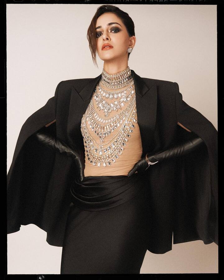 Ananya wore a black pant suit with a jewelled translucent blouse underneath.