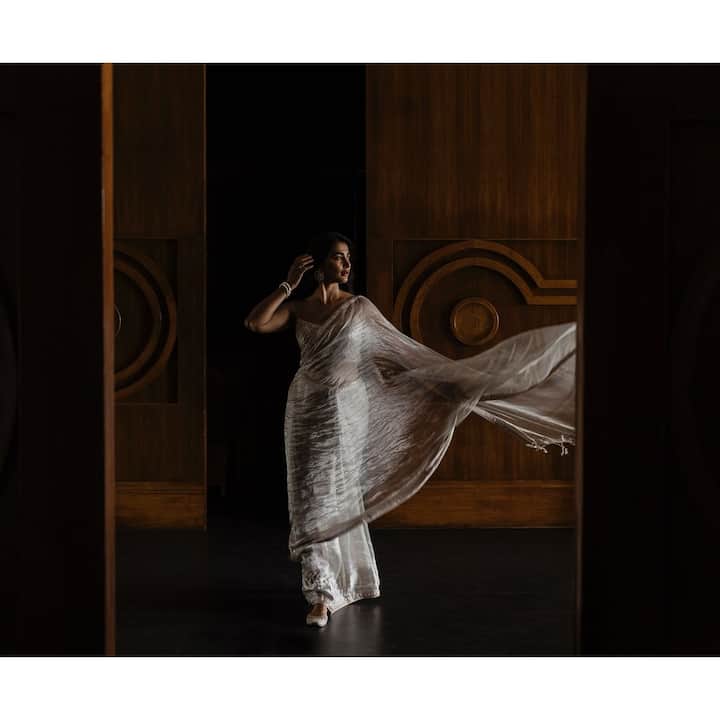 The Telugu actress wore a silver tissue saree for an event, and her pictures and clips from the event are going viral.