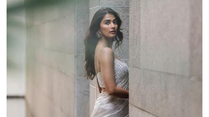 Pooja Hegde treated fans with pictures in a silver tissue saree from Matsya World