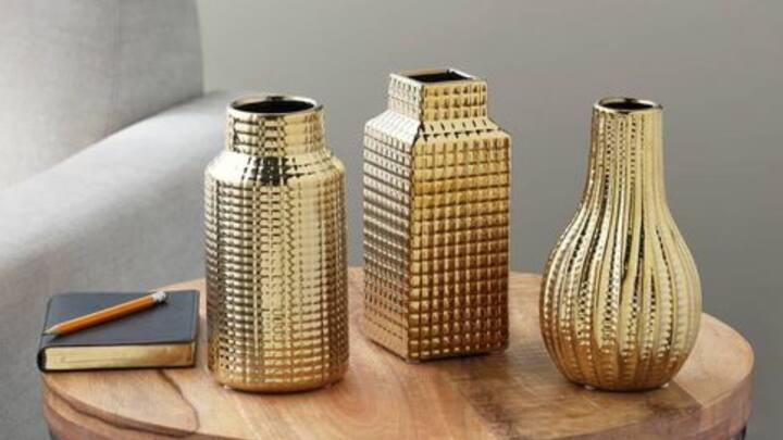 5. Play With Metallic Accents: Metallic accents like gold, silver, and copper are good for elevating your decor. Bring out metallic allure with vases, picture frames, and tableware during festive periods. (Image Source: Pinterest/michaelsstores)