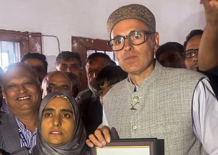 Jammu and Kashmir National Conference Vice President Omar Abdullah receives the victory certificate after winning from Budgam constituency in the J-K Assembly elections, in Srinagar. (Image Source: PTI)