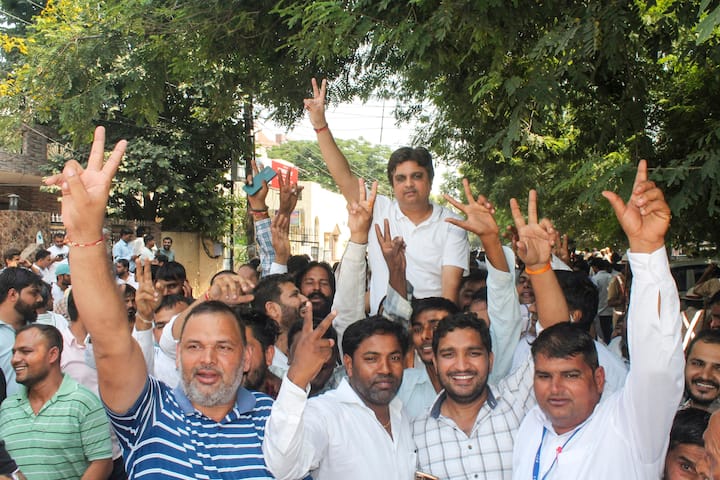 Supporters of Congress candidate from Prithla constituency Raghubir Singh Tewatia celebrate his win in Haryana Assembly polls, in Faridabad, Tuesday, Oct. 8, 2024. (Image Source: PTI)