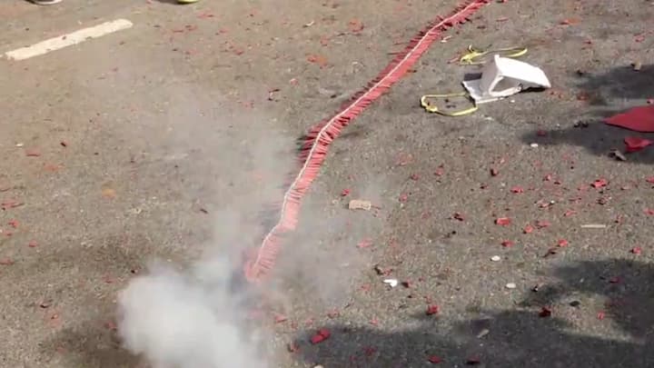 Workers burst firecrackers outside AICC headquarters in Delhi. (Photo: PTI)