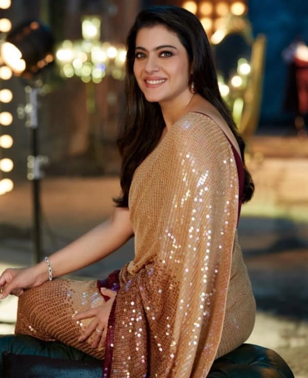 Kajol has worn a golden and brown shade saree with sequence here. You can also style yourself with this saree look of the actress on the occasion of Durga Puja.