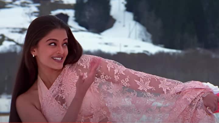 Pink Sheer Saree in Mohabbatein: For a softer look in Navratri, the pink saree from Mohabbatein can be your inspiration. This delicate and dreamy saree look by Aishwarya, with its ethereal design, is perfect for those looking to keep it minimal yet elegant during festivities. (Image source: Youtube/ YRF)