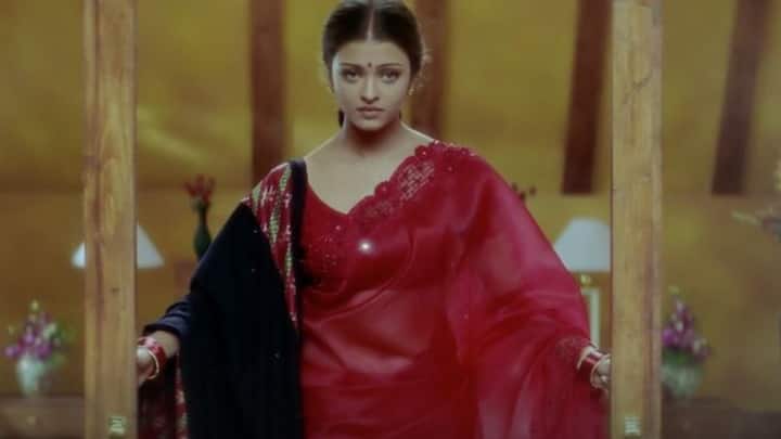 Red Saree in Hum Dil De Chuke Sanam: One of the most iconic looks for Navratri, Aishwarya Rai’s vibrant red saree with simple embroidery from the movie 'Hum Dil De Chuke Sanam' is a perfect Garba night inspiration. Paired with a black Kutch embroidery shawl, this glamorous traditional ensemble is ideal for festive flair while dancing the night away. (Image source: Pinterest/ Todd)