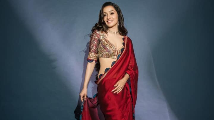 Shraddha Kapoor in Satin Georgette Saree: Shraddha Kapoor looked ethereal in a crimson-red Satin Georgette saree with Ajrakh sequin sprinkles and scallop edging. The saree was perfectly complemented by a hand-embroidered Zari and sequin Ajrakh blouse, making it an exquisite pick for Karwa Chauth celebrations. (Image source: Instagram/ shraddhakapoor)
