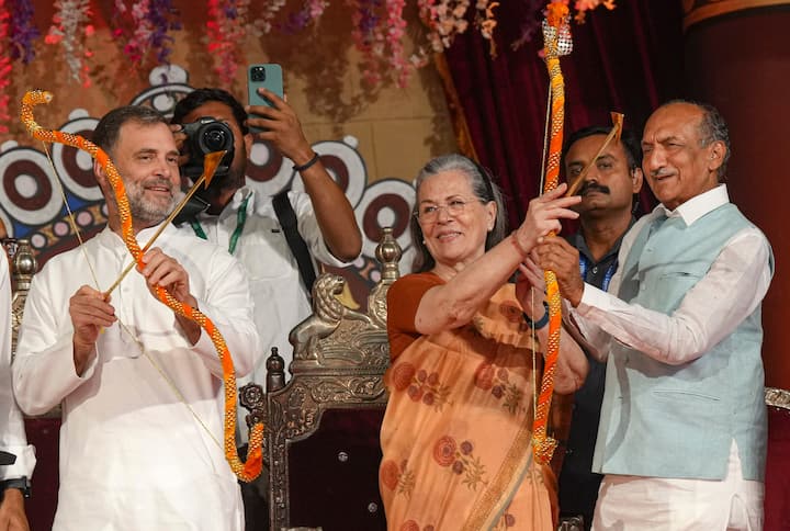 Congress leaders Sonia Gandhi and Rahul Gandhi hold bows and arrows during the Dussehra (Vijayadashami) festival celebration organised by Nav Shri Dharmik Leela Committee, at the Red Fort ground, in New Delhi, Saturday, Oct. 12, 2024. Congress leader Jai Prakash Agarwal is also seen. (Source: PTI)