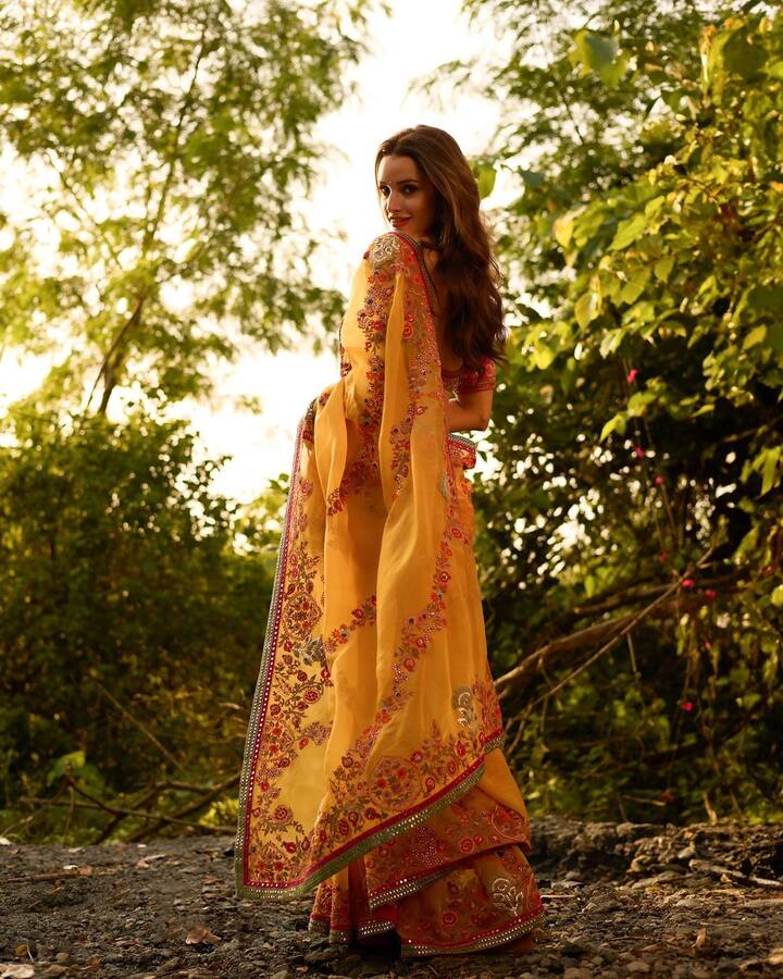 She chose to style her hair in soft waves, letting them fall freely over her shoulders, adding a touch of romance to the ensemble.