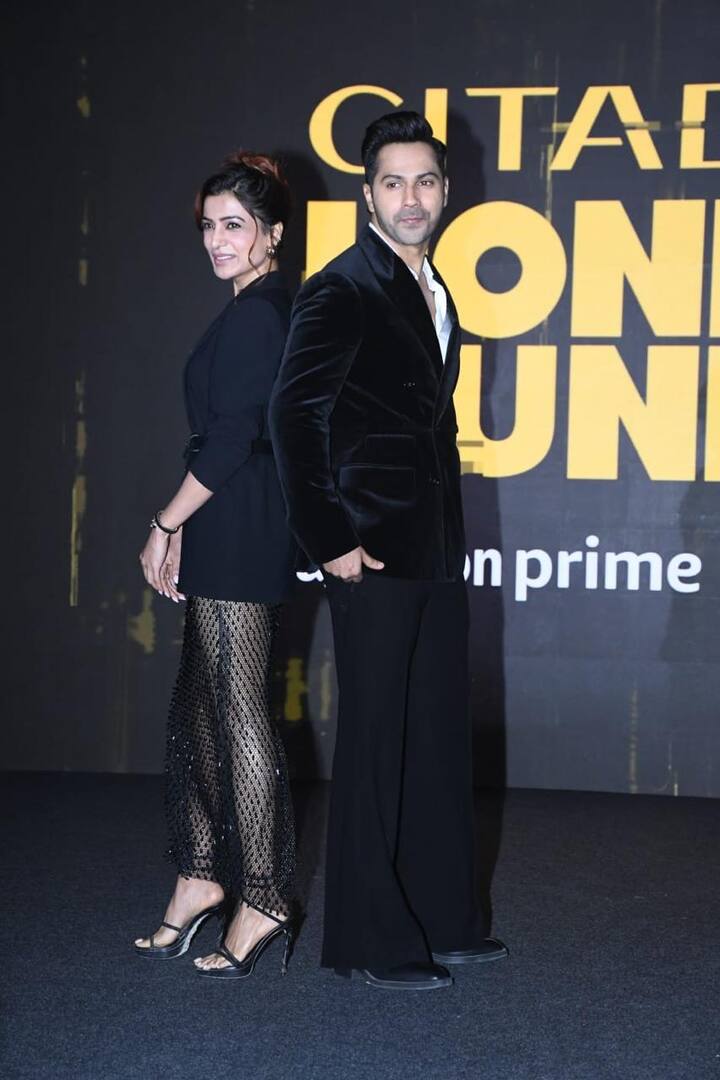 Varun Dhawan opted for a black suit with white shirt.