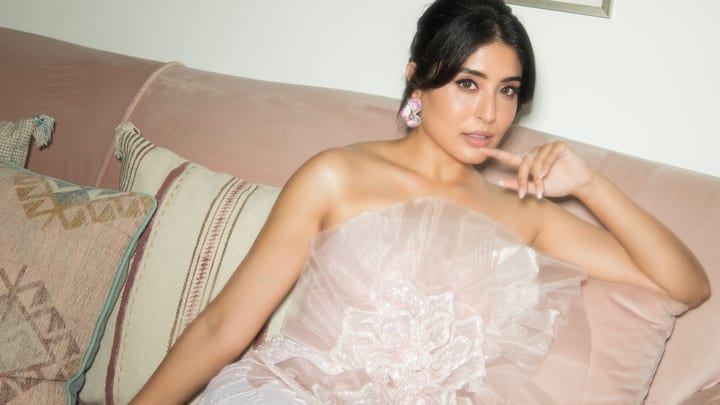 In a stunning showcase of elegance, Kritika Kamra captivates with her latest look in a pastel pink floral dress.