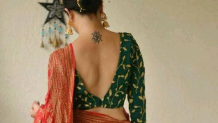 V- Neck Embroidery Blouse: This deep V-neck embroidered silk blouse in pastel colours offers a stunning and elegent look, that is perfect for any skin tone. (Image source: Pinterest/ fashionswithharsha)