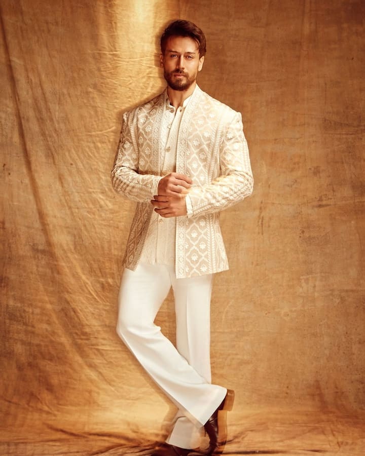 Tiger Shroff steps up the style game with an ivory ethnic three-piece featuring thread designs.