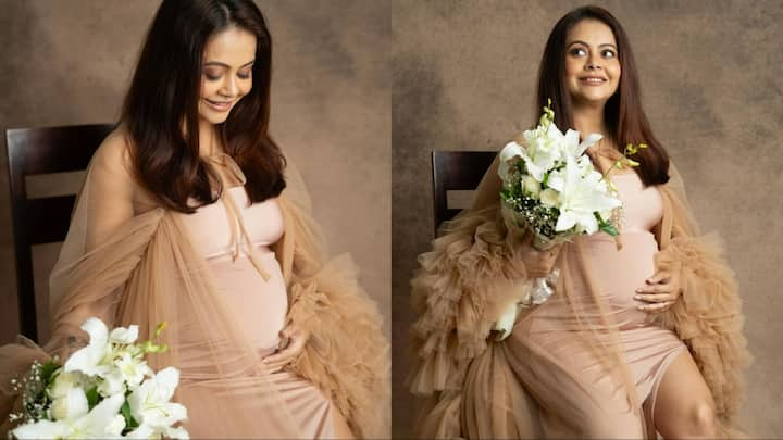 Devoleena Bhattacharjee Pics: टीवी एक्ट्रेस देवोलीना भट्टाचार्जी ने एक बार फिर अपने प्रेग्नेंसी फोटोशूट से कुछ खूबसूरत तस्वीरें शेयर की हैं.  जो इंटरनेट पर तेजी से वायरल हो रही हैं.