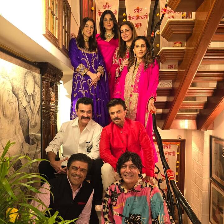 The husbands posing with the wives. Anil Kapoor was seen in a red kurta, Sanjay Kapoor in a white casual outfit, Chunku in a printed pink shirt and white pants.