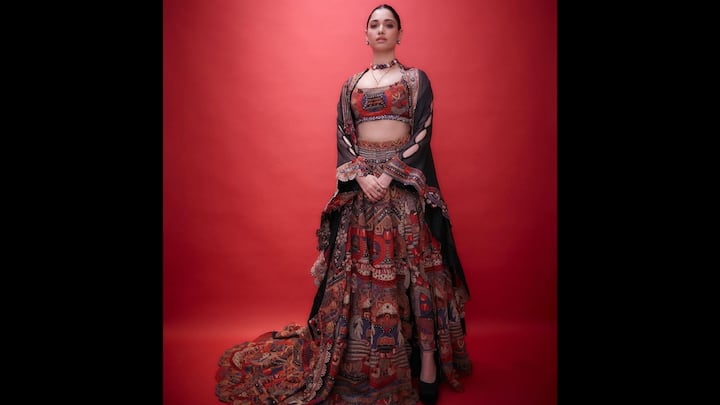 3. Multicoloured Four Piece Set: Tamannaah's four-piece attire complements the Indo-Western style. It includes a jacket, trousers, lehenga, and blouse. The neckline of the blouse is deep and lovely. For the Diwali festivities, this multicoloured ensemble is ideal. Tamannaah has accessorised her ensemble with a multicoloured necklace and minimalistic earrings that go well with it. Her jacket features lovely cutouts on the arms, and the lehenga's split adds a contemporary element to the traditional outfit. (Image Source: Instagram/@tamannaahspeaks)