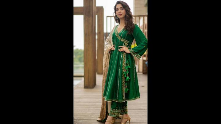 4. Green Anarkali: In her stunning green anarkali, Tamannaah looks breathtaking. The anarkali has beautiful golden detailing all across it. Her festive style is greatly enhanced by the large statement earrings that she has matched with her ensemble. She has also worn a beige dupatta that complements her green anarkali for this festive season. (Image Source: Instagram/@tamannaahspeaks)