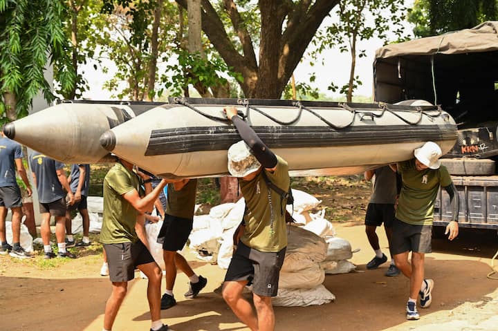 Indian Navy personnel carry out preparations for Humanitarian Assistance and Disaster Relief (HADR) operations in view of cyclone 'Dana' which is expected to make landfall in Odisha, on Thursday, Oct 24, 2024. (Image Source: PTI)