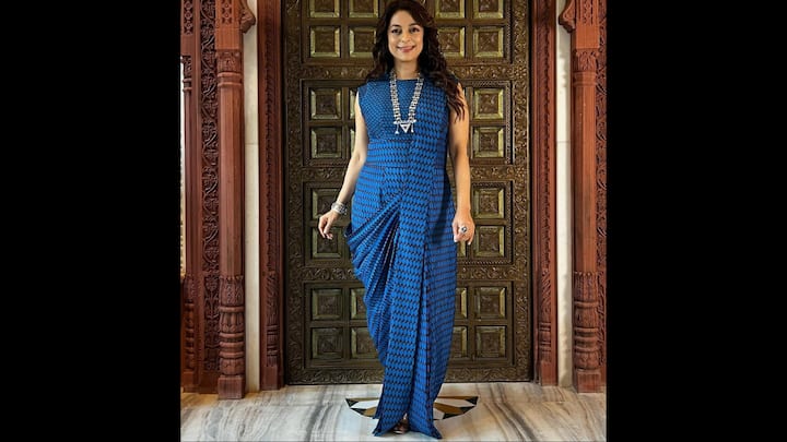 5. Contemporary Blue Draped Saree: The flowing blue saree worn by Juhi Chawla is a modern take on a classic design. Its chic cut and impeccable design makes it a perfect choice for Diwali parties with a traditional yet modern twist. (Image Source: Instagram/@iamjuhichawla)