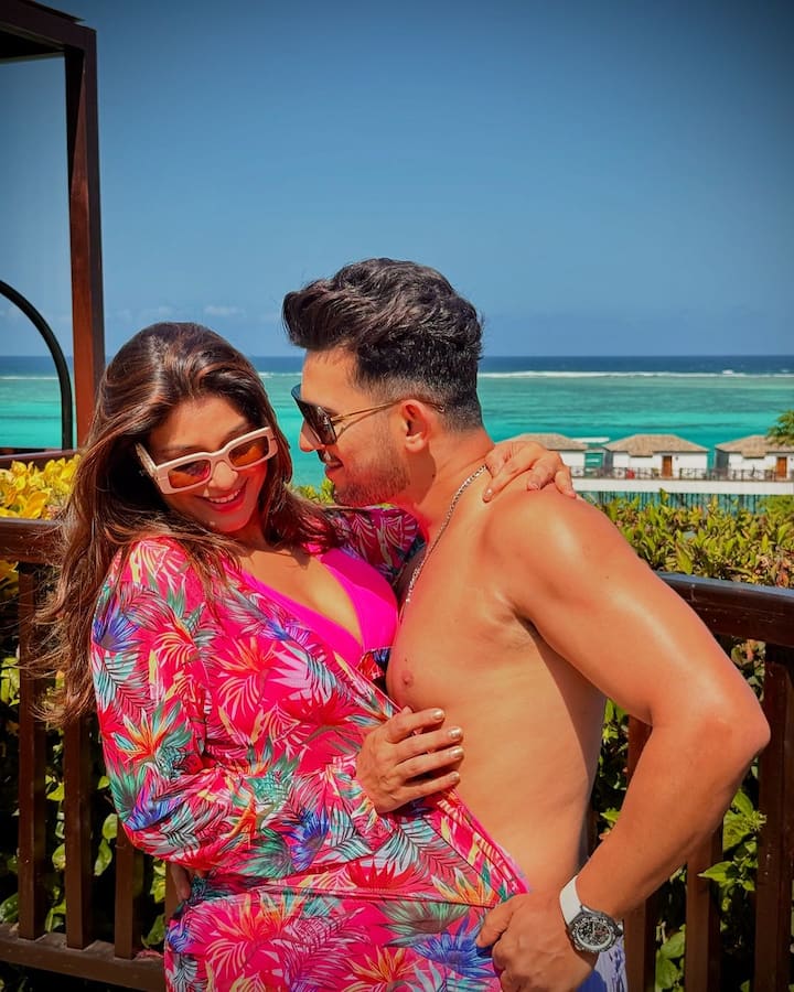 Another mushy picture, showcased the actor lovingly kissing on his wife’s neck.