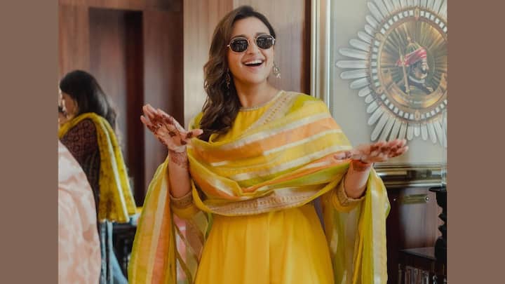 Parineeti Chopra: Parineeti kept it traditional with a simple yellow anarkali suit for her haldi ceremony, styled with an A-line patterned dupatta. The outfit, paired with open hair and light makeup, was ideal for any festive occasion. (Image source: Instagram/ parineetichopra)