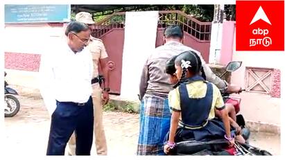 Mayiladuthurai District Collector advises parents about helmet - TNN குழந்தைகளுடன் இருசக்கர வாகனத்தில் சென்ற பெற்றோர் - வழி மறித்த ஆட்சியர் - காரணம் என்ன?