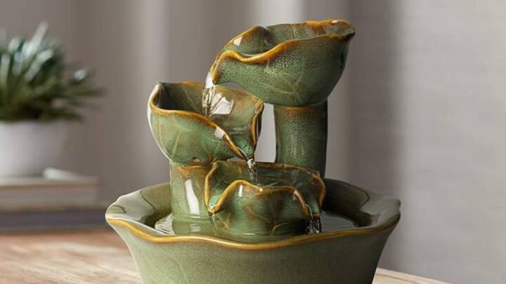 5. Water Features in the North-East: It is auspicious to position water elements like small fountains or aquariums in the north-east corner as it enhances positive energy flow and financial prosperity. To ensure financial progress, ensure the water is always clean and moving to avoid stagnant energy. (Image source: Pinterest/ Lamps Plus)