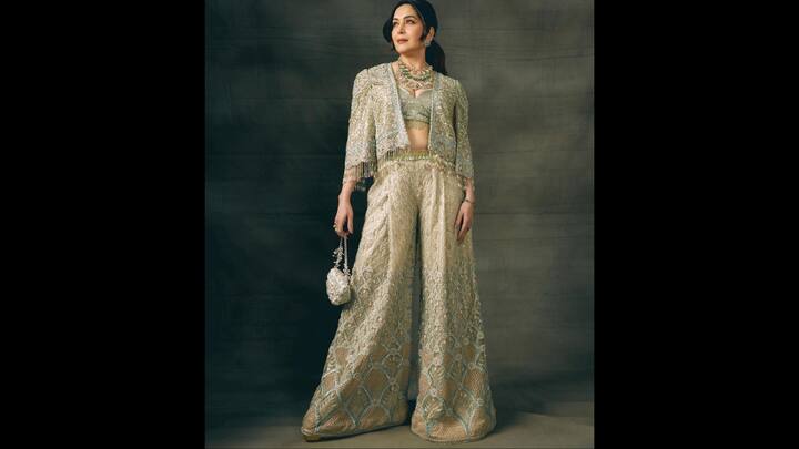 1. Embellished Pastel Green Elegance: Madhuri’s chic pastel green outfit, looks fabulous with its wide-legged pants paired with a short embroidered jacket. The look exudes pure sophistication. The intricate detailing of the attire makes it a perfect pick for an elegant Diwali evening which balances tradition with contemporary flair. (Image Source: Instagram/@madhuridixitnene)