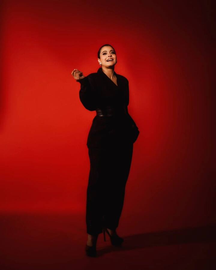 She paired it with straight-fit black trousers. A sturdy black belt cinched at the waist, showcasing her fashion-forward sensibility.