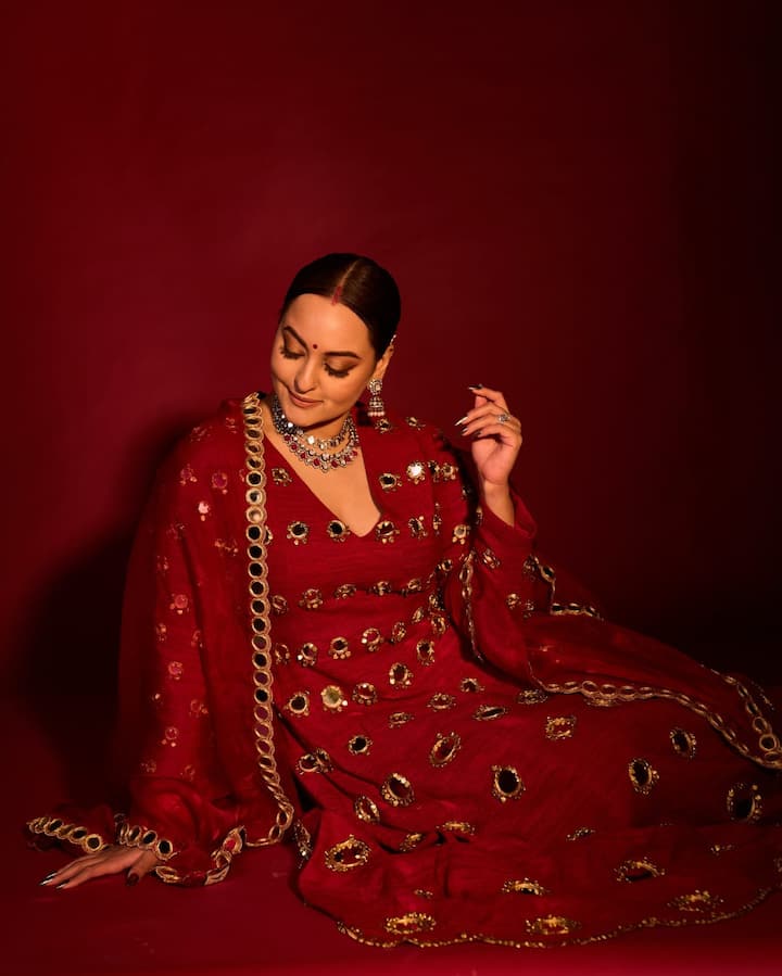 Mirror-Work Anarkali: Exuding diva vibes, Sonakshi looked ethereal in a red Anarkali suit featuring mirror work and gold-tone embroidery.