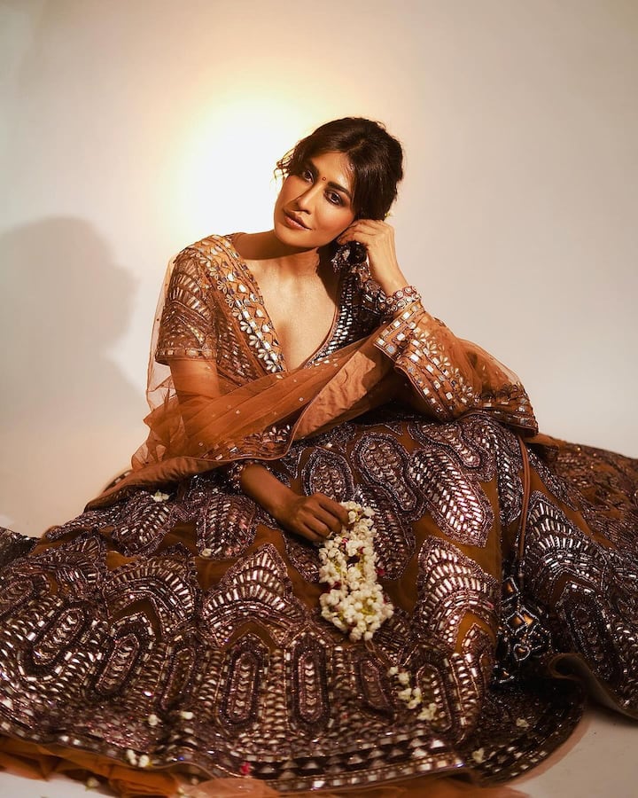 For a festive sparkle, she chose a golden lehenga saree and kept her makeup glowing.