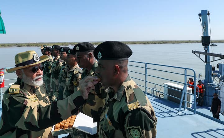 Prime Minister Narendra Modi visited Sir Creek near the Indo-Pak border in Gujarat's Kutch district and offered sweets to jawans.