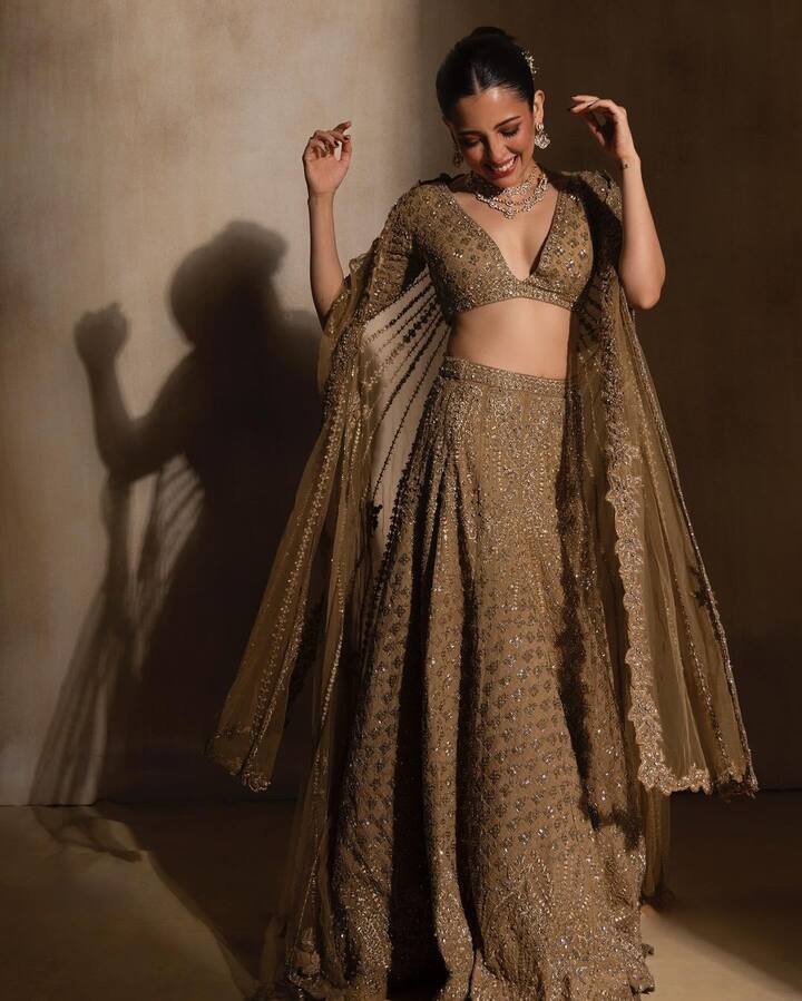 Dressed to Dazzle: In this elegantly elegant ethnic golden lehenga with a matching blouse, Barkha Singh embodies grace and grandeur. She is truly dripped in gold with this outfit, making our hearts skip a beat.