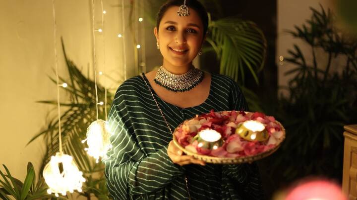 2. Parineeti Chopra: Parineeti channelled traditional glamour in a green and white striped suit, complete with a striking choker. Its silhouette and soft fabric exude simplicity and elegance, making it ideal for festive gatherings. (Image Source: Instagram/@parineetichopra)