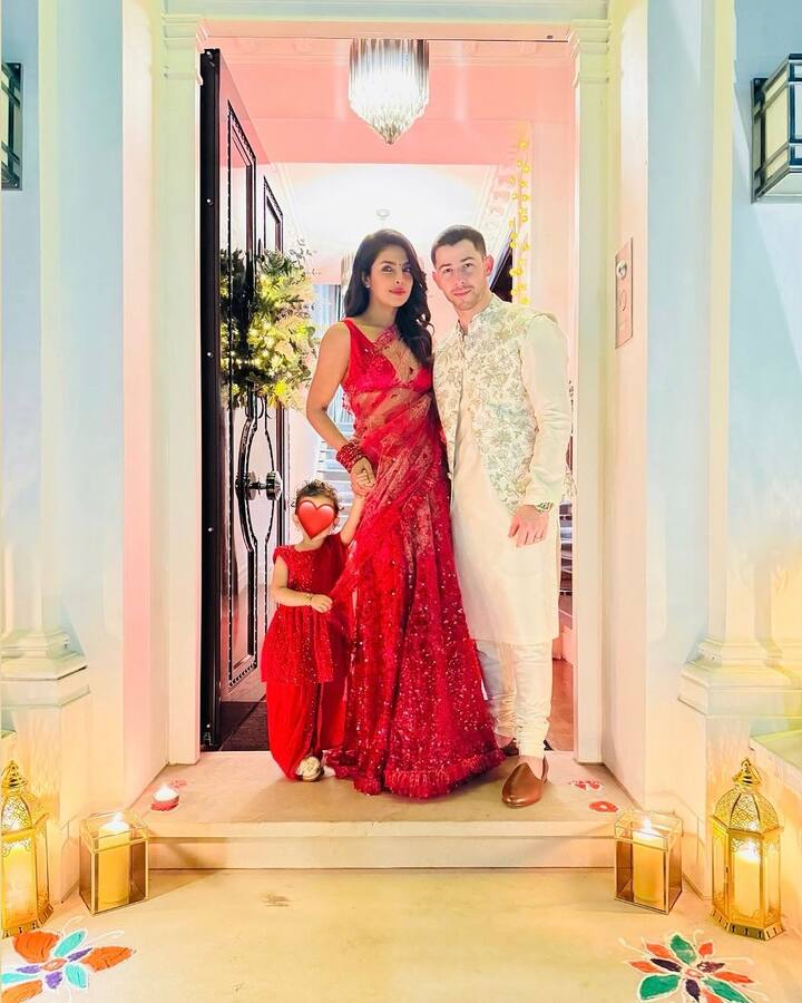 In one photo, she stuns in a lacy red saree while Nick complements her in an ivory kurta pyjama. Little Malti, dressed in a matching red outfit, was held lovingly in Priyanka's arms.