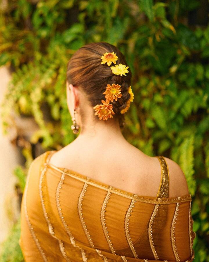 Alia's hair was decorated with marigolds for a traditional festive look.