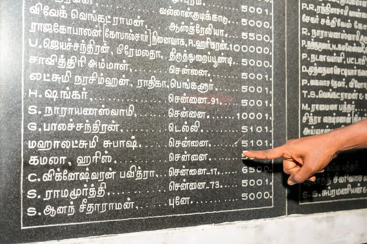 Names of people, who contributed to the construction of Shri Dharmasastha Temple, engraved on a wall of the temple where a special victory prayer was organised for Democratic Presidential candidate Kamala Harris in the US election, in Mannargudi, Tamil Nadu, Monday, Nov. 4, 2024. (Image Source: PTI)