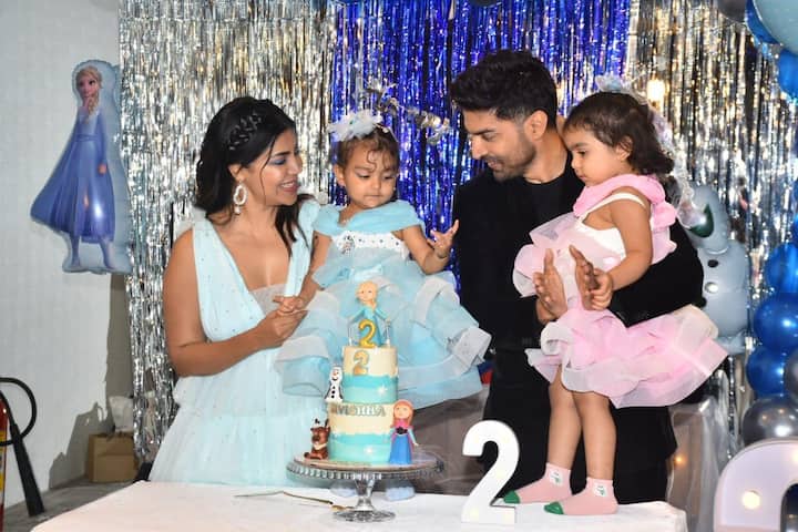 The birthday girl was dressed in a blue frock and her look was accessorised with a flower clip.