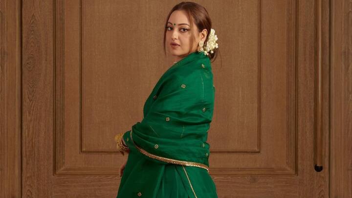 Deep Green Traditional Suit: The light deep green suit with a little golden work worn by Sonakshi along with heavy earrings is quite an elegant combination. (Image source: Instagram/ aslisona)