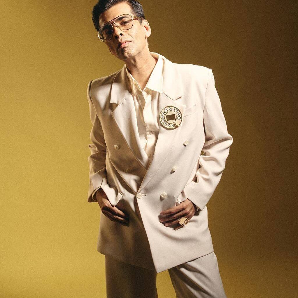 Karan Johar Stuns In An Ivory Pantsuit With Telephone Dial Brooch