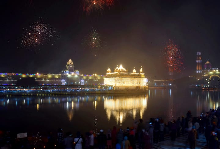 A large number of devotees gathered at gurdwaras across the country on Friday to celebrate the 555th birth anniversary of Guru Nanak Dev, the founder of Sikhism. An illuminated Golden Temple as fireworks light the sky on the occasion of Guru Nanak Jayanti, the birth anniversary of the first Sikh guru, in Amritsar, Friday, Nov. 15, 2024. (PTI Photo)