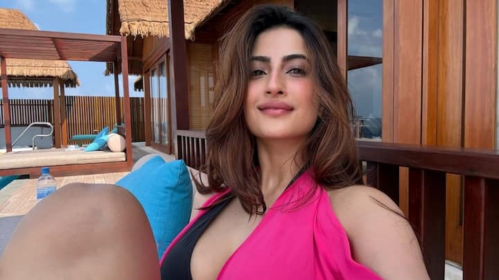 Palak Tiwari posted a series of breathtaking photos from her recent trip to the Maldives, where she posed in a black bikini paired with a matching sarong and a bright pink cover-up.