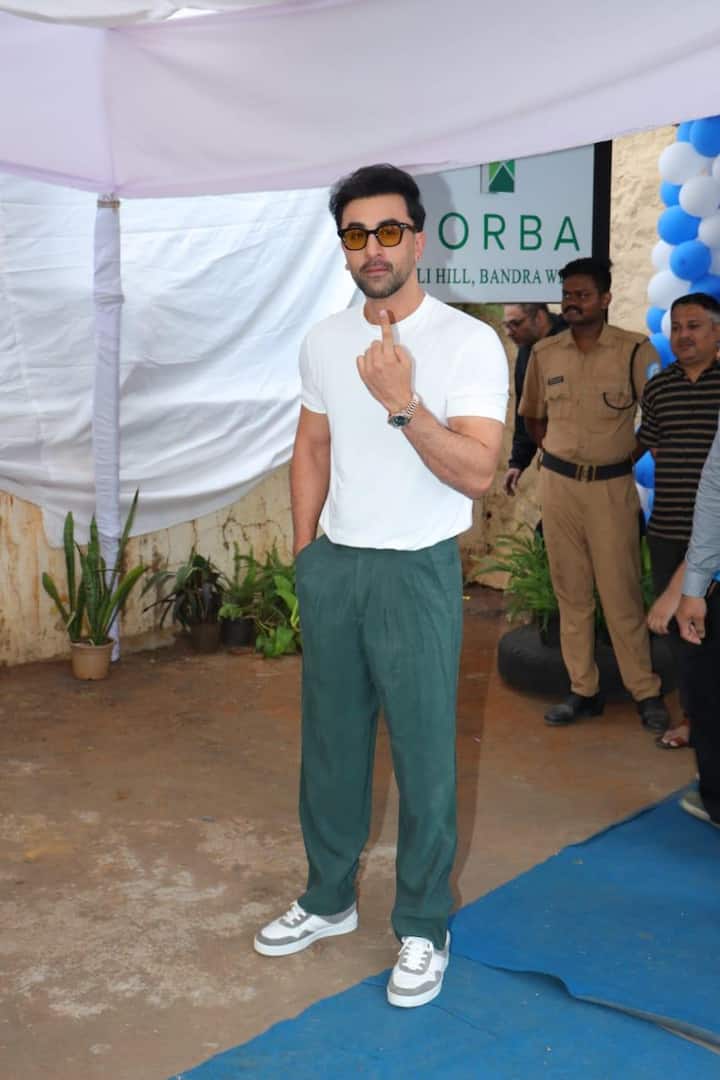 Ranbir Kapoor posed for the paparazzi positioned outside the polling station.