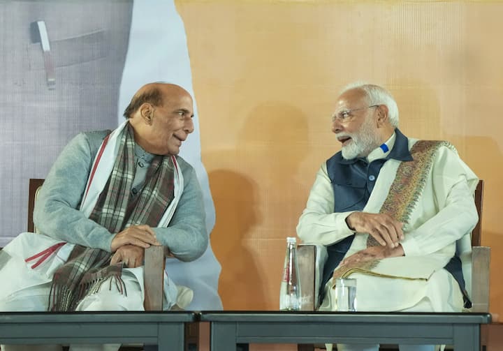 Prime Minister Narendra Modi with Defence Minister and senior BJP leader Rajnath Singh during the celebration of the party's victory in the Maharashtra Assembly elections and in several bypolls, at BJP headquarters in New Delhi, Saturday, Nov. 23, 2024. (Image Source: PTI)