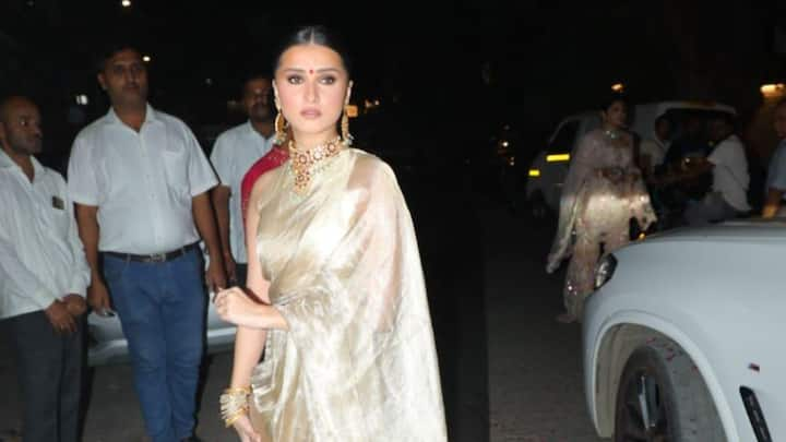 Tara Sutaria was papped at her friend Shraddha Mehta's wedding in a golden saree looking like a vintage queen.