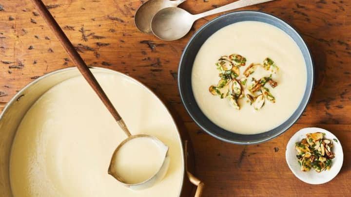 8. Cauliflower And Almond Soup: Cauliflower and almond soup combines roasted cauliflower’s mild flavour with the richness of almonds. It creates a creamy, nutty, and comforting dish packed with nutrients and healthy fats. (Image Source: Pinterest/goodhousemag)